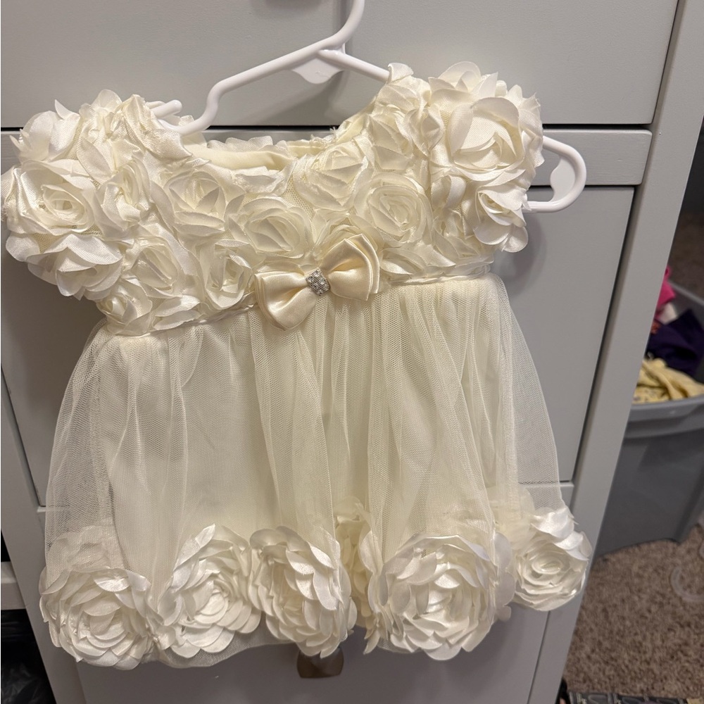 Elegant Cream Baby Dress with Floral Accents